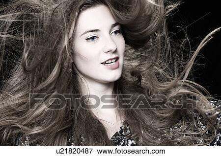 Girl with long flying hair View Large Photo Image Stock Photo - Girl with long flying hair. Fotosearch