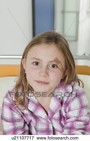 Girl with plaster in hospital bed View Large Photo Image Stock Photo - Girl with plaster in hospital bed. Fotosearch