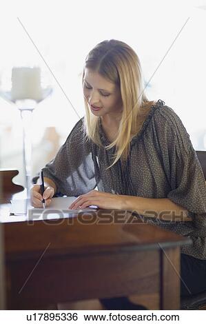Stock Photograph - Girl writing a letter. Fotosearch