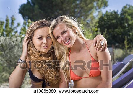 Girlfriends portrait in swimwear sun View Large Photo Image Stock Image - Girlfriends portrait in swimwear sun. Fotosearch