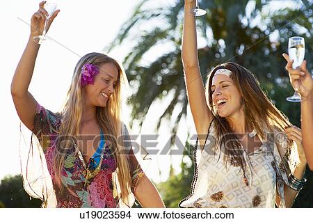 Picture - Girls celebrating with champagne. Fotosearch