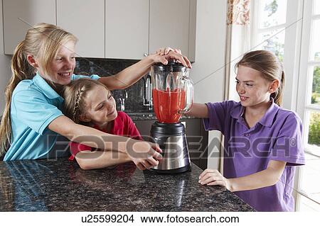 Girls mixing fruit in blender View Large Photo Image Picture - Girls mixing fruit in blender. Fotosearch