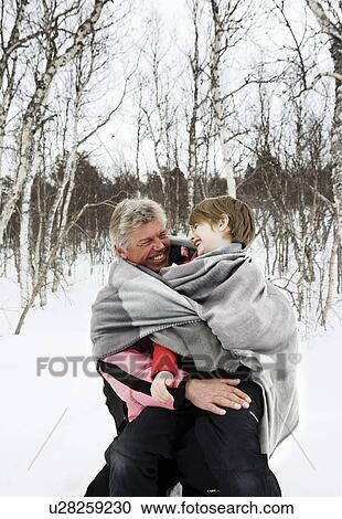 Grandfather and Grandson in snow View Large Photo Image Stock Image - Grandfather and Grandson in snow. Fotosearch