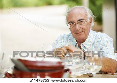 Grandfather at diner table View Large Photo Image Stock Image - Grandfather at diner table. Fotosearch