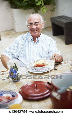 Grandfather having lunch View Large Photo Image Picture - Grandfather having lunch. Fotosearch