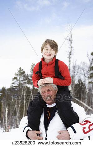 Grandfather with grandson on shoulders View Large Photo Image Stock Image - Grandfather with grandson on shoulders. Fotosearch