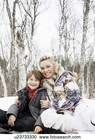 Grandmother and son in snow View Large Photo Image Stock Image - Grandmother and son in snow. Fotosearch