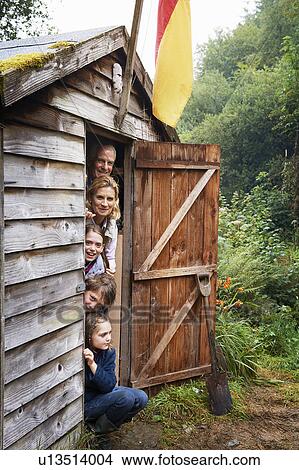 Grandparents and children hiding in shed View Large Photo Image Picture - Grandparents and children hiding in shed. Fotosearch