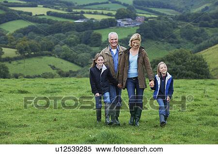 Stock Photography - Grandparents and children on a walk. Fotosearch