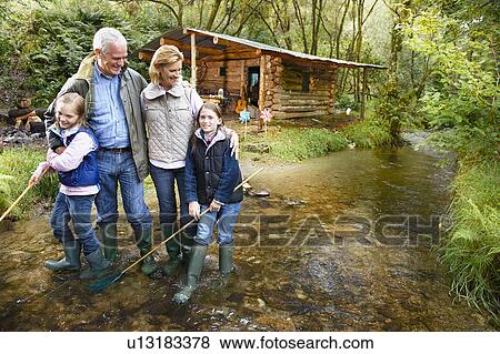 Grandparents and grandchildren hugging View Large Photo Image Stock Photo - Grandparents and grandchildren hugging. Fotosearch