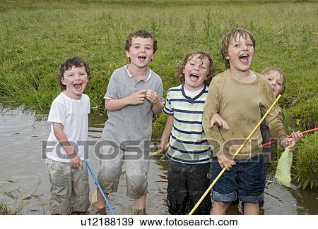 Group of boys singing in the river View Large Photo Image Stock Photo - Group of boys singing in the river. Fotosearch