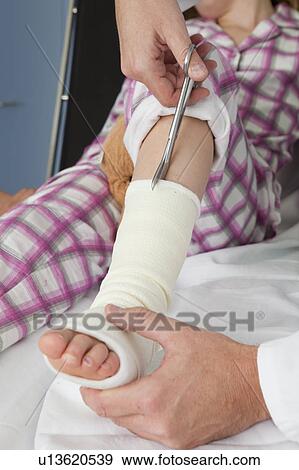 Hands cut opening a plaster View Large Photo Image Stock Photo - Hands cut opening a plaster. Fotosearch
