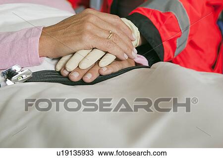 Hands of ambulance woman caring View Large Photo Image Stock Image - Hands of ambulance woman caring. Fotosearch