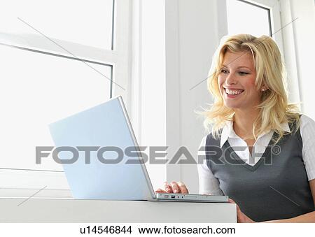 Happy business women at work View Large Photo Image Picture - Happy business women at work. Fotosearch