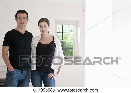 Happy couple in bright new home View Large Photo Image Stock Photography - Happy couple in bright new home. Fotosearch
