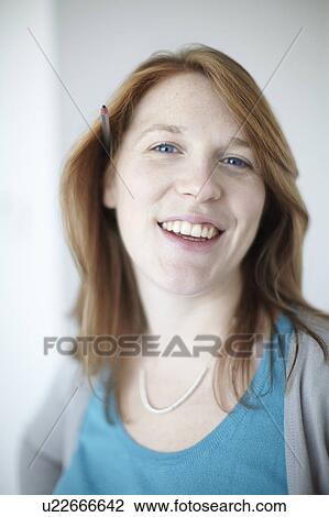 Happy girl with pencil behind ear View Large Photo Image Stock Image - Happy girl with pencil behind ear. Fotosearch