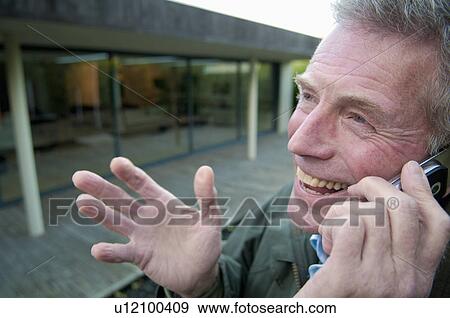 Stock Photo - Happy senior on phone. Fotosearch