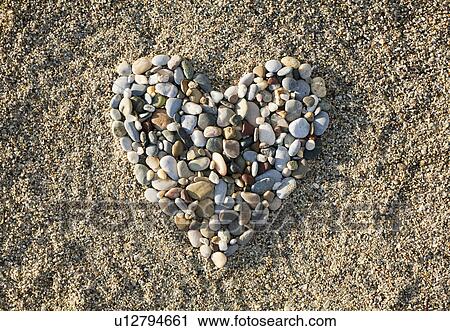 Heart made of pebbles on beach View Large Photo Image Stock Image - Heart made of pebbles on beach. Fotosearch