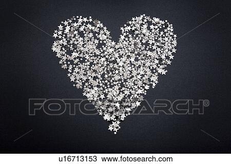 Heart shape figure made of small stars View Large Photo Image Stock Image - Heart shape figure made of small stars. Fotosearch