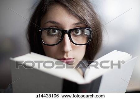 Stock Photograph - Hipster reading a book. Fotosearch