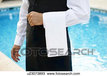 Hotel waiter by pool View Large Photo Image Stock Image - Hotel waiter by pool. Fotosearch