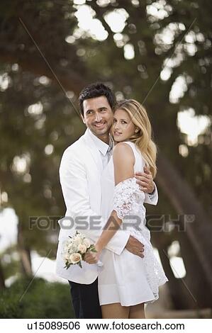 Stock Photograph - Hugging bridal couple. Fotosearch