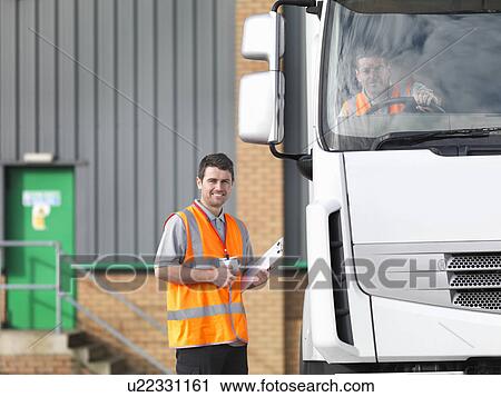 Inspector and truck driver in truck View Large Photo Image Stock Image - Inspector and truck driver in truck. Fotosearch