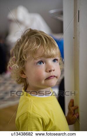 Stock Image - Kid looking up. Fotosearch