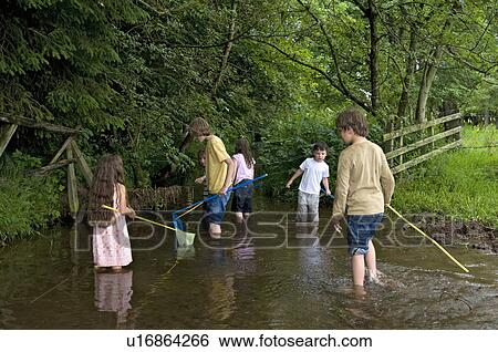 Kids fishing in the river View Large Photo Image Stock Photograph - Kids fishing in the river. Fotosearch