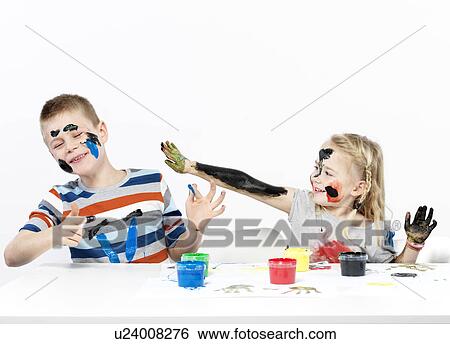 Kids playing with finger paint View Large Photo Image Stock Photograph - Kids playing with finger paint. Fotosearch