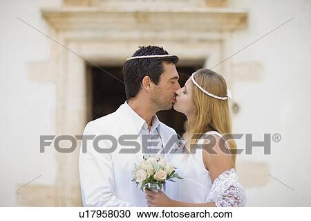 Kissing bridal couple View Large Photo Image Stock Image - Kissing bridal couple. Fotosearch