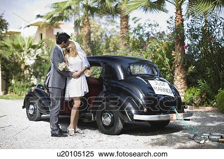 Kissing bridal couple View Large Photo Image Stock Photography - Kissing bridal couple. Fotosearch