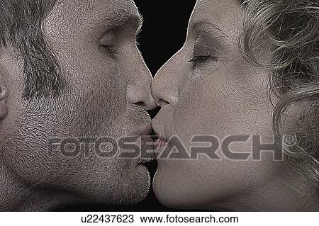 Stock Image - Kissing couple. Fotosearch