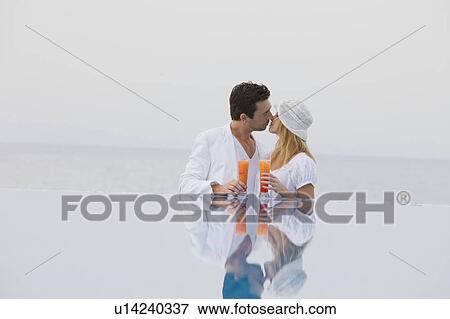 Kissing couple View Large Photo Image Stock Photo - Kissing couple. Fotosearch