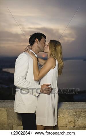 Stock Photo - Kissing couple. Fotosearch
