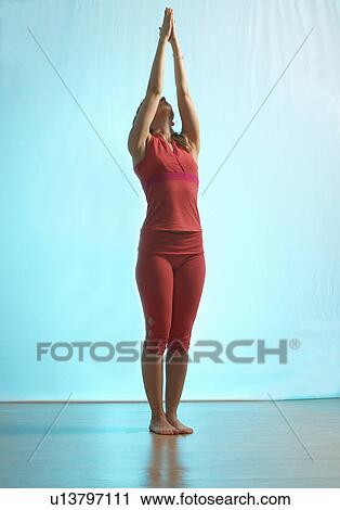 Lady doing yoga in a studio View Large Photo Image Stock Image - Lady doing yoga in a studio. Fotosearch