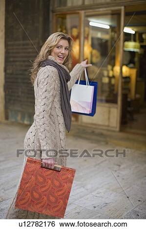 Lady with shopping-bags View Large Photo Image Stock Photograph - Lady with shopping-bags. Fotosearch