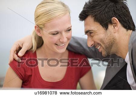 Laughing couple View Large Photo Image Stock Photo - Laughing couple. Fotosearch