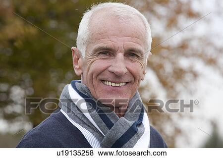 Laughing man outdoors in autumn View Large Photo Image Stock Photo - Laughing man outdoors in autumn. Fotosearch