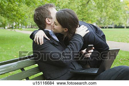 Man and woman greeting in park View Large Photo Image Picture - Man and woman greeting in park. Fotosearch