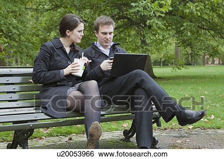 Stock Photograph - Man and woman on lunch break. Fotosearch