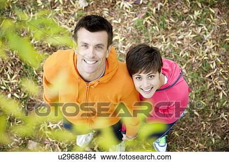 Picture - Man and woman ready for workout in park. Fotosearch
