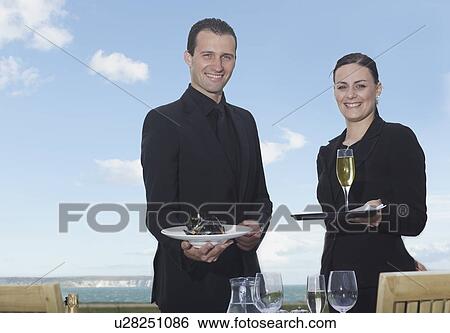 Stock Photograph - Man and woman smiling to camera. Fotosearch