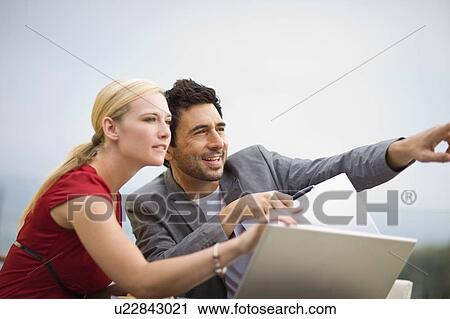 Stock Image - Man and woman talking. Fotosearch