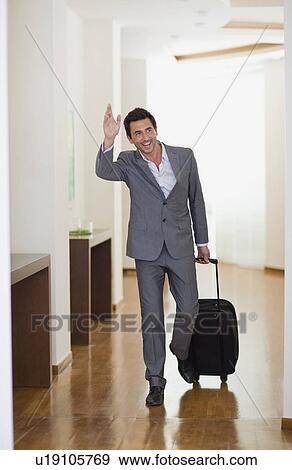 Man arriving at hotel View Large Photo Image Stock Photo - Man arriving at hotel. Fotosearch
