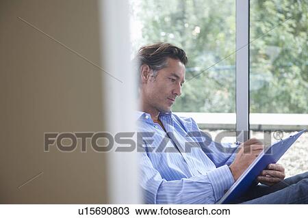 Man at the office, relax View Large Photo Image Stock Image - Man at the office, relax. Fotosearch