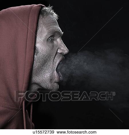 Man breathing out View Large Photo Image Stock Photo - Man breathing out. Fotosearch