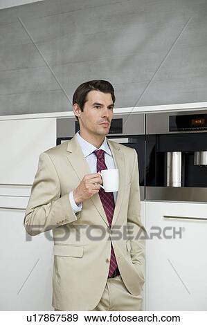 Man drinking coffee View Large Photo Image Stock Photo - Man drinking coffee. Fotosearch