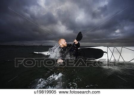 Man in kayak rotating View Large Photo Image Stock Photography - Man in kayak rotating. Fotosearch