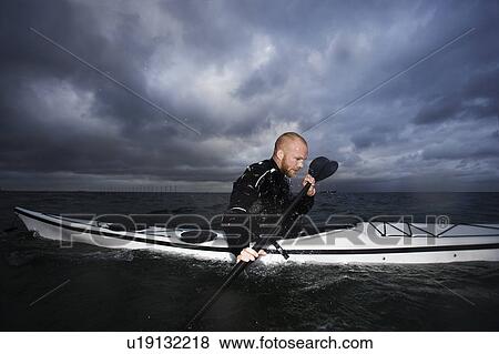 Man in kayak View Large Photo Image Stock Photo - Man in kayak. Fotosearch